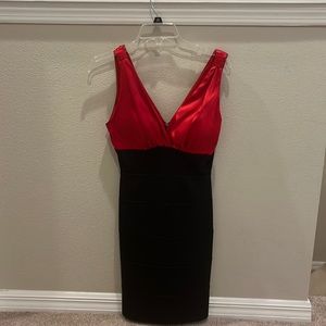 A black and red v-neck tighter fitted dress. It is pretty fancy.